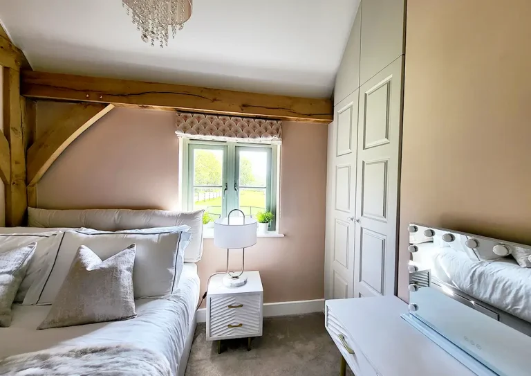 Guest bedroom with fitted wardrobe.