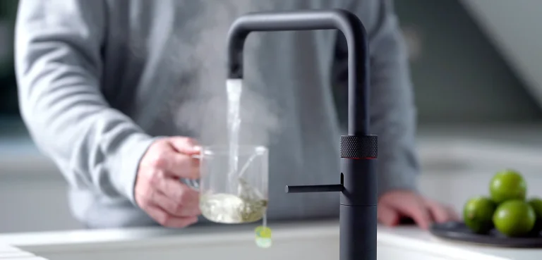 Quooker tap pouring instant hot water to make a cup of tea.